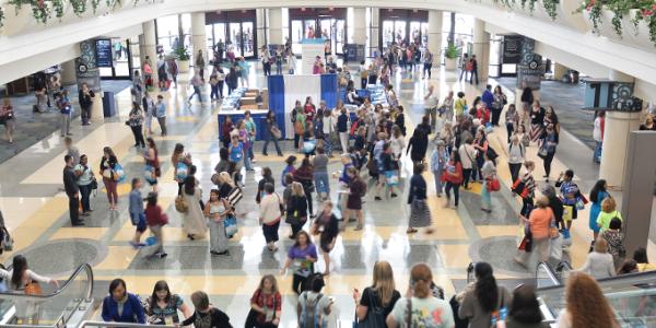 a crowd of people in a building at an event