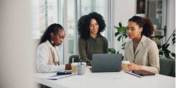 A group of women at a conference table