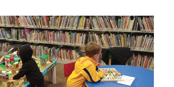 Children playing in play centers at a library