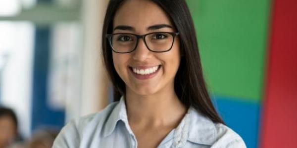 Teacher standing in classroom