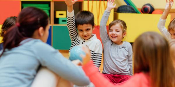 Preschool children sitting in a circle