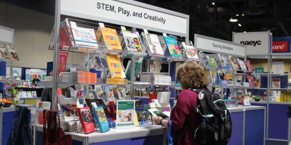 conference attendees browsing at NAEYC books.