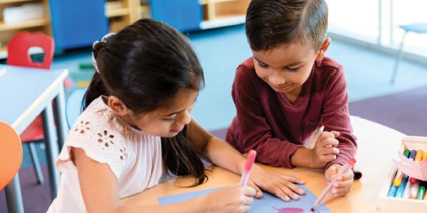 children doing art on a table