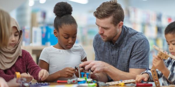 Teacher helping a student in the classroom