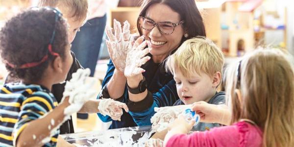 Teacher working with students in a classroom