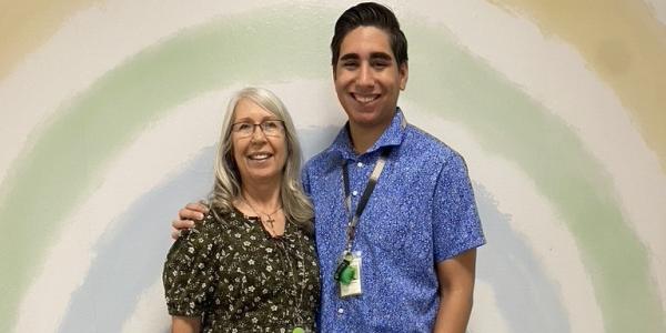 Two teachers posing with each other