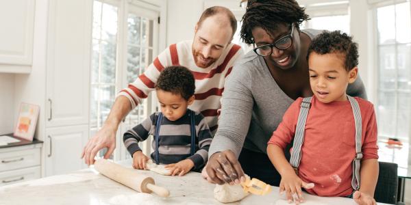 Parents helping children in the kitchen