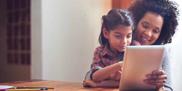 Mom and child reading from tablet