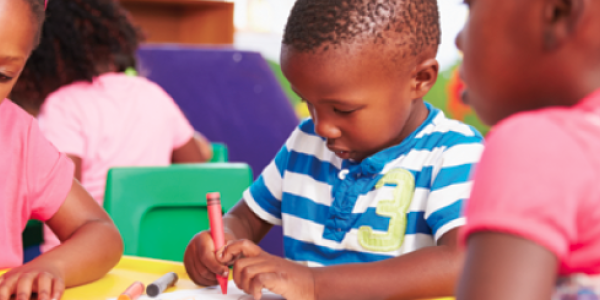 Children drawing on drawing table