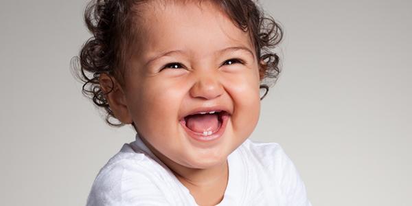 Infant smiling and laughing