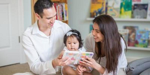 Family reading with toddler