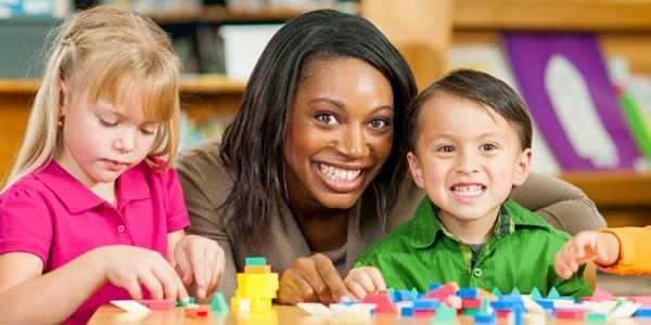 two children with a teacher