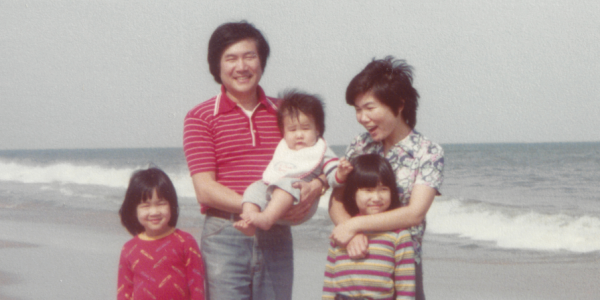 a vintage photo of a family at a beach