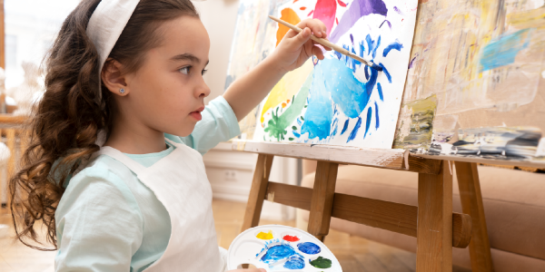 a child painting in class
