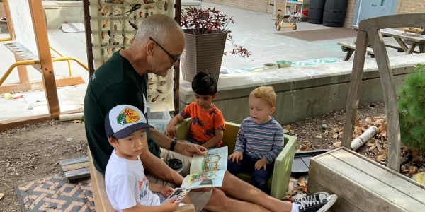 NAEYC Fall 2025 Member Spotlight Eric Unrau reading to children