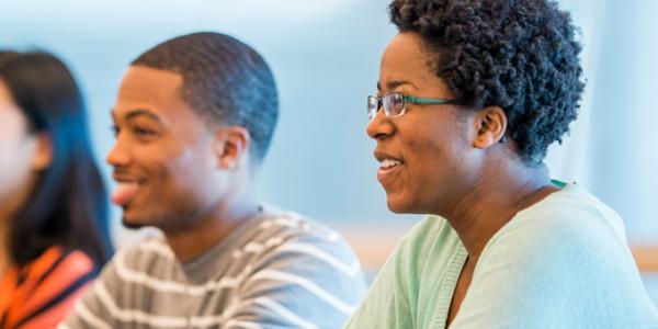 Early childhood professionals listen attentively to a lecture