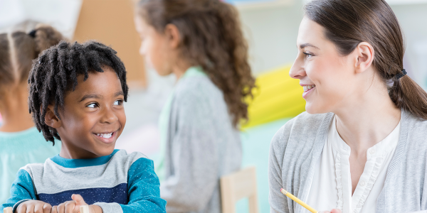 a teacher talking with a child