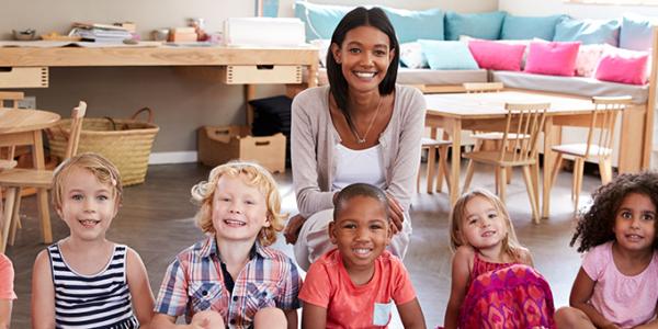 educator in an early learning program with children