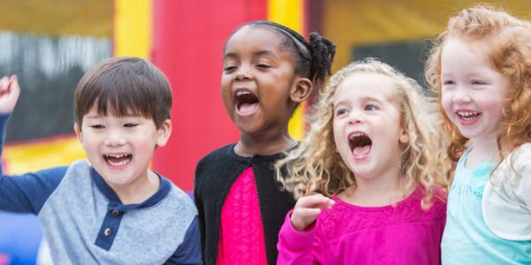 Excited children in classroom.