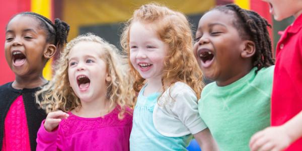 Preschoolers singing and laughing