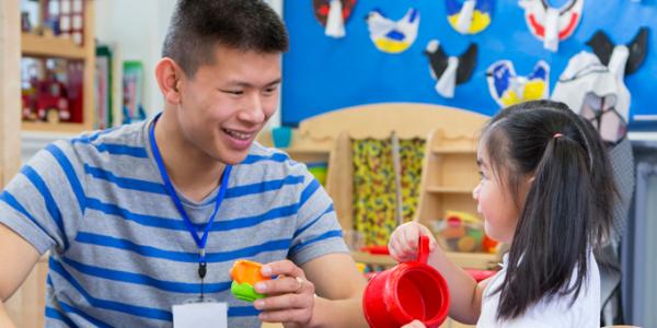 Teacher with student to encourage learning Teacher with student to encourage learning