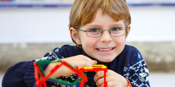 Young boy playing with educational toys