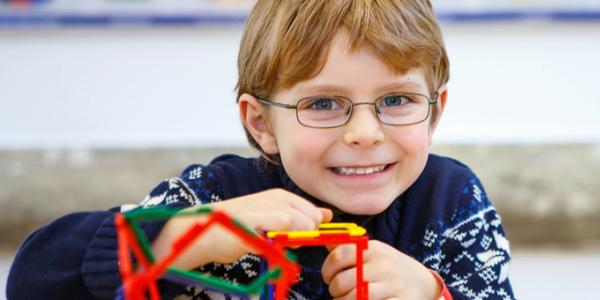Young boy playing with educational toys