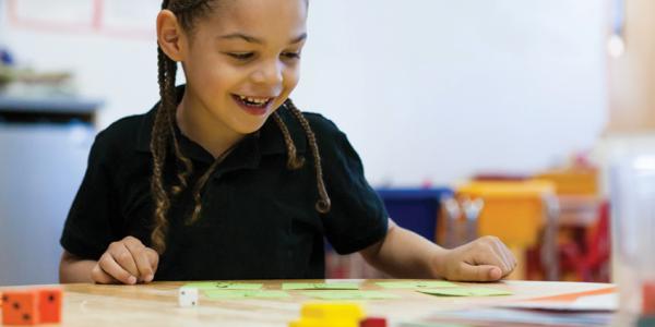 Child enjoying math activities.