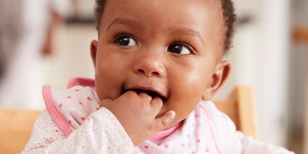 Toddler with hand in mouth