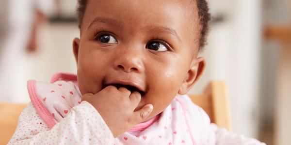 Toddler with hand in mouth