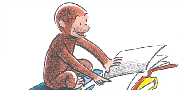 Curious George reading a book