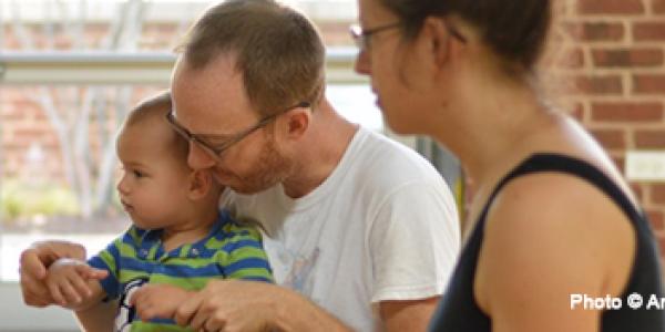 Parents singing with child