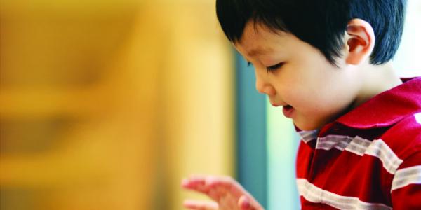 Child reading out loud.