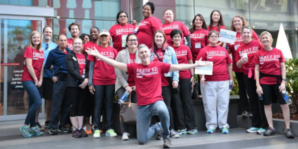 A group of professionals wearing red Early Ed for America shirts