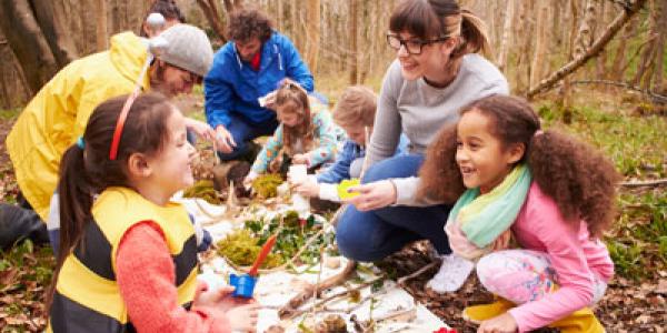 Children and adults working together to learn about the environment