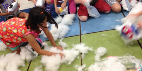 Children playing with pillows for maker fest