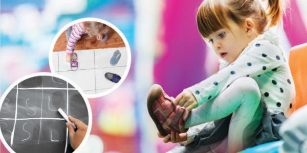 A young child participates in a math activity charting children's types of shoes.