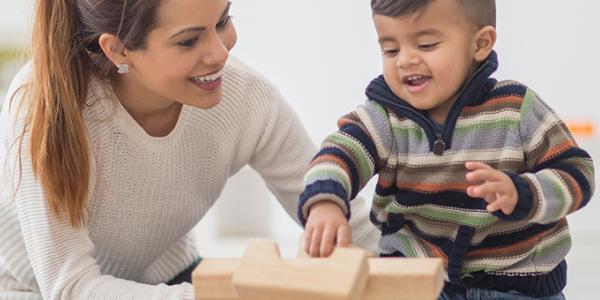 Toddler building with blocks
