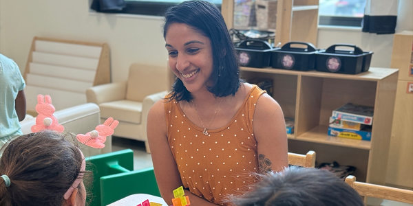 Teacher working with students in a classroom