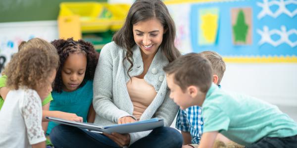 Teacher working with students in a classroom