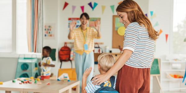mother introducing her child to their teacher