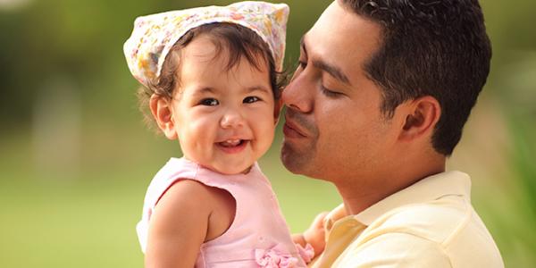 Dad singing to daughter