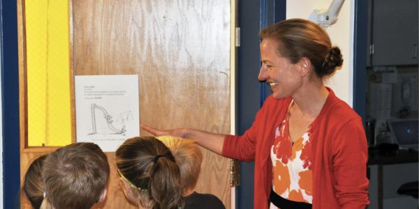 Teacher showing students an illustration