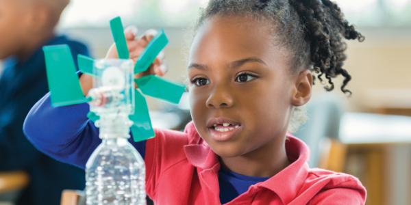 young girl doing a creative science experiment