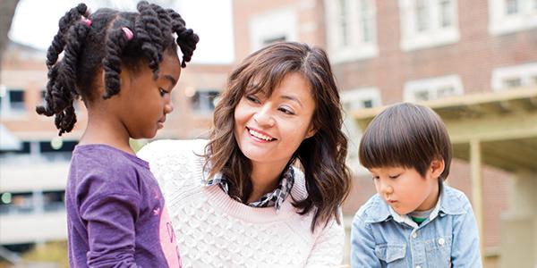 teacher speaks with students