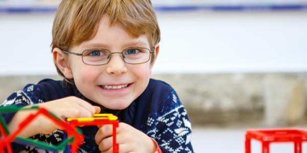 Little boy building structure