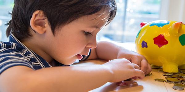 Young child counting with coins