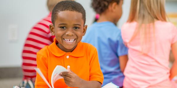 A young boy enjoying a book