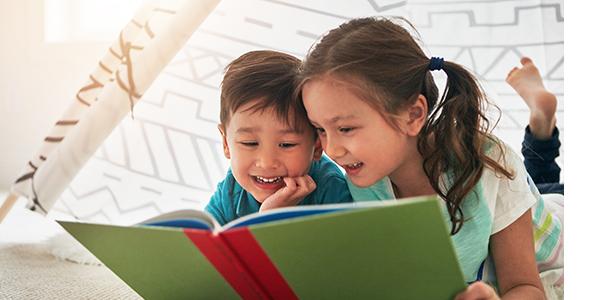 Two children reading with each other.