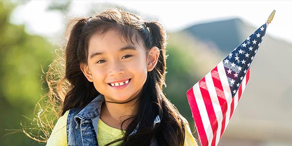 Young girl holding an American flag